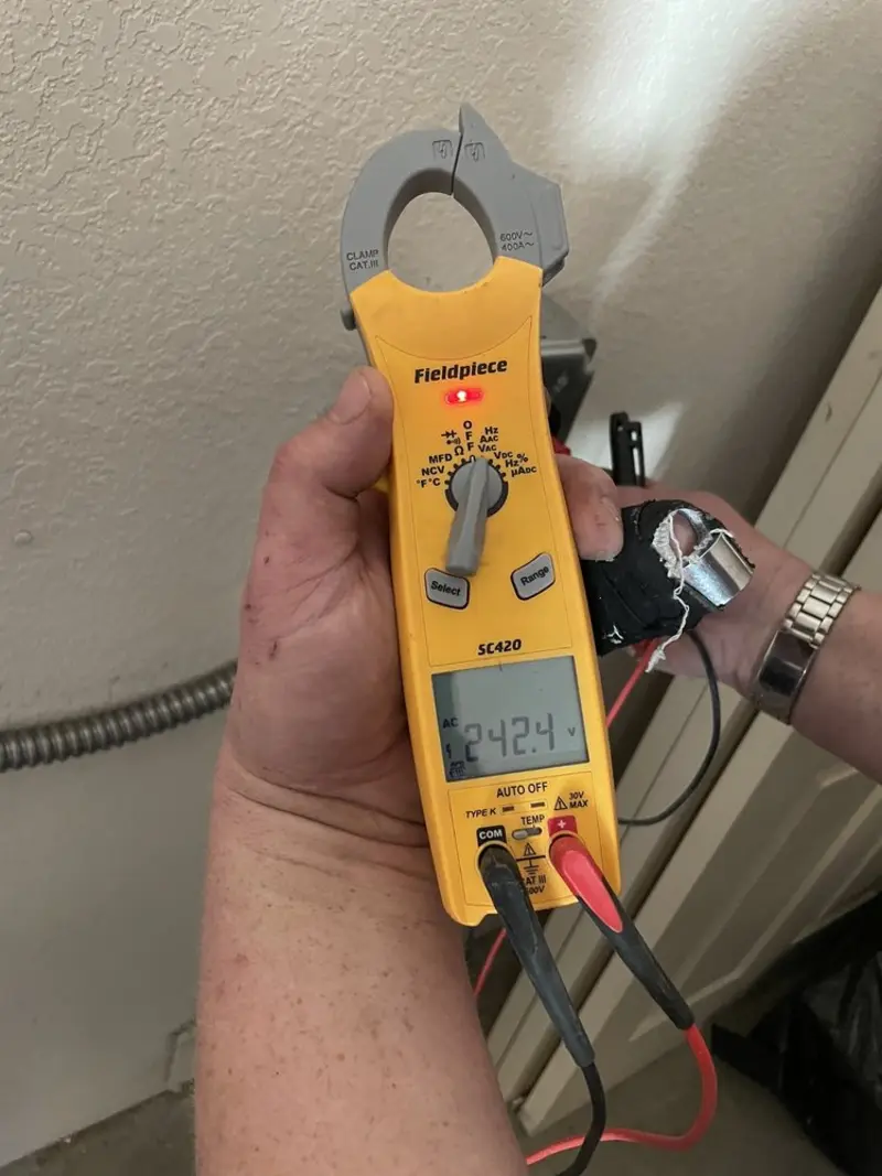 Voltage testing with clamp meter during Electrical Installation Services in Jasper